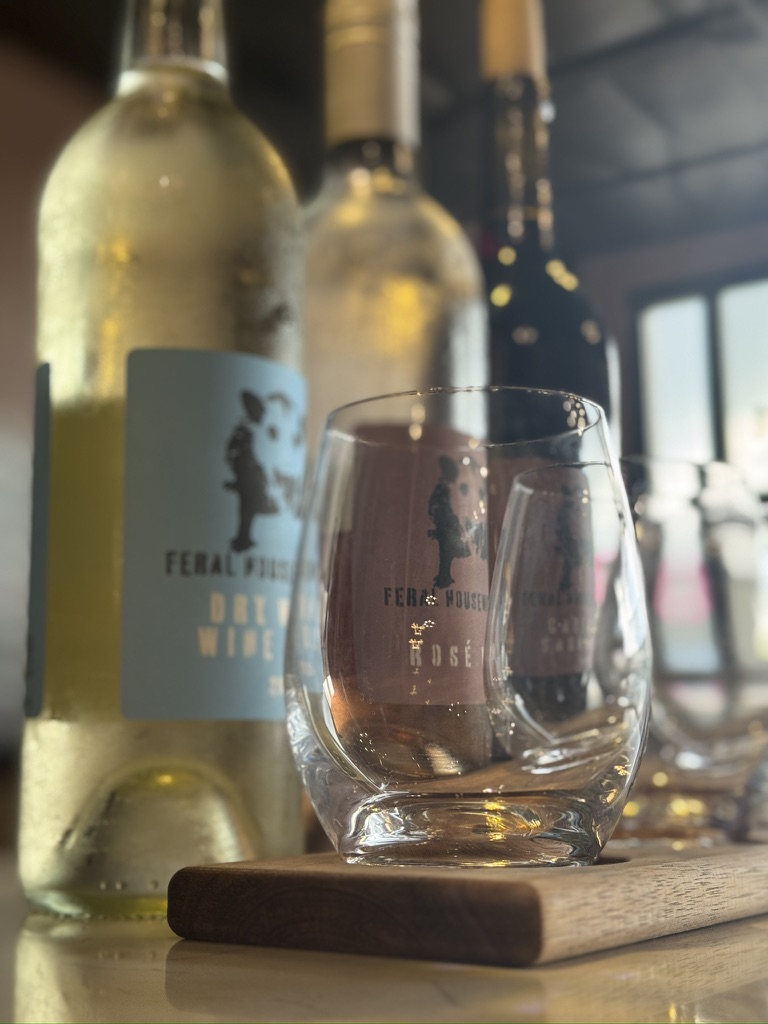 Feral Housewife wines and tasting glasses ready for a wine flight